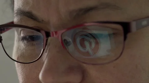 Pinterest Logo Reflection in Glasses of Middle Aged Female Stock Footage 75031337
