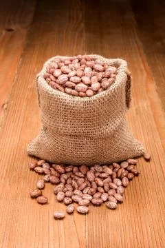 Pinto beans in burlap bag Stock Photos