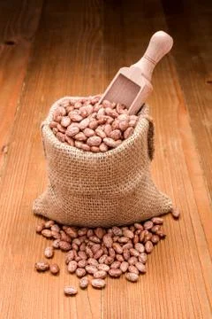 Pinto beans in burlap bag Stock Photos