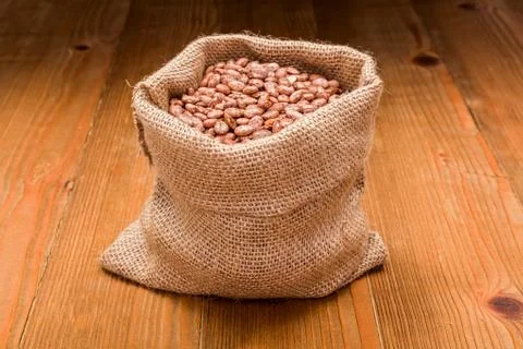 Pinto beans in burlap bag Stock Photos