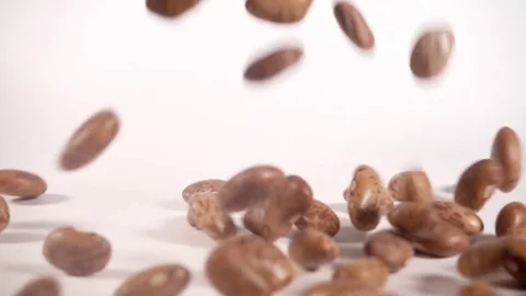 Pinto beans falling and bouncing in slow motion Stock-Footage 77392964