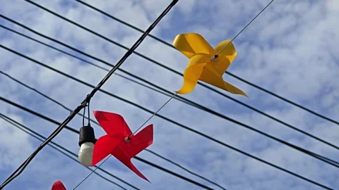 Pinwheel or windmill rotate from windy on sky background. Stock Footage 304437155