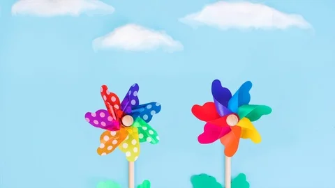  pinwheels in the blue sky Video stock 112987160