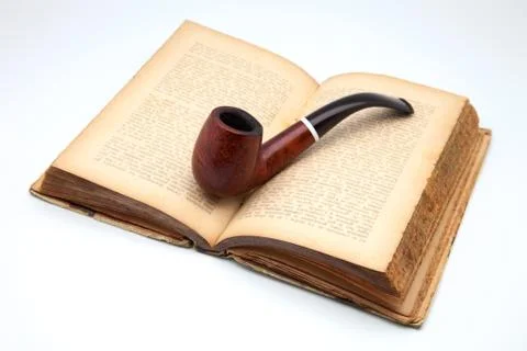 Pipe and book Stock Photos
