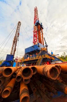 Pipe and drilling rig in the sky Stock Photos