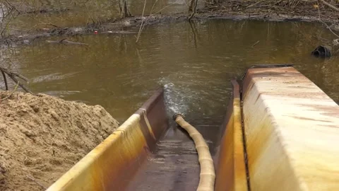 Pipe and stream with visible pollution near drainage channel Vídeo Stock 346408637