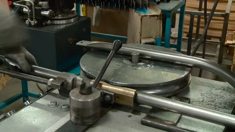 A pipe bending machine is in operation at a metalworking plant Video stock 309476950