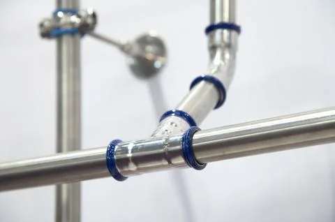 A pipe with blue caps on it Stock Photos