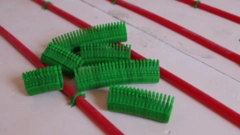 Pipe clamps for underfloor heating installers, fastening plastic pipes Stock Footage 315507609
