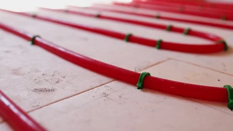 Pipe clips for underfloor heating installation workers fixing plastic pipes Video stock 315507593