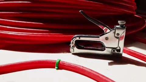 Pipe clips for underfloor heating installation workers fixing plastic pipes Stock Footage 315507596