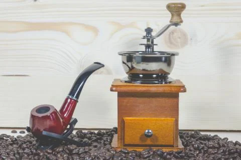 Pipe coffee beans Coffee grinder Stock Photos