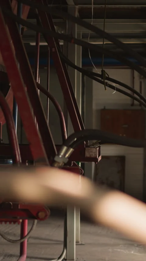 Pipe connected to huge boiler on support in mechanical room Видео 309885804