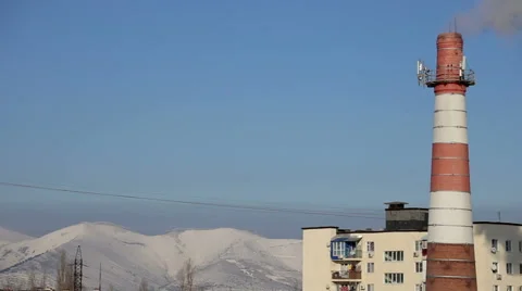 Pipe factory pollutes the city environment Stock Footage 58850737