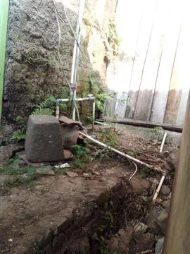 Pipe installation in the village Stock Photos