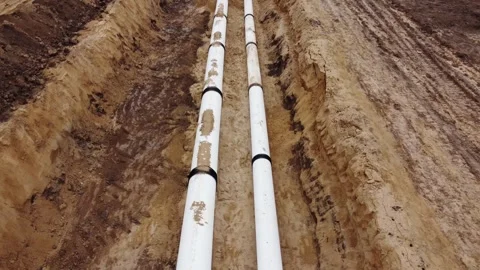 A pipe is laying on the ground with a hole in the middle Stock Footage 304780155