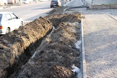 Pipe laying in the ground Stock Photos