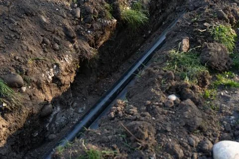 Pipe laying in the ground Stock Photos
