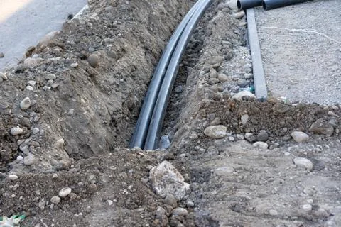 Pipe laying in the ground Stock Photos