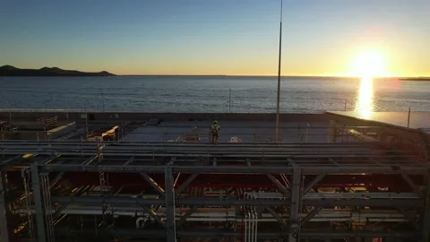 Pipe line conection in oil refinery at dusk twilight near the sea Stock Footage 171295417