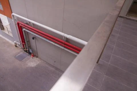 Pipe line on the wall of the building Stock Photos