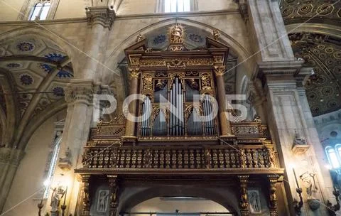 Pipe organ inside of Roman Catholic cathedral of Como, Italy. Stock Photos