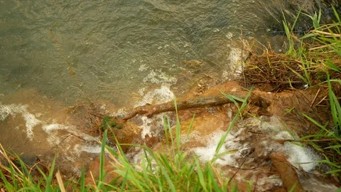 Pipe outlet drainage system in field for flowing agricultural landscape. Cloudy Stock Footage 129581022
