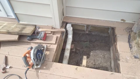 Pipe Repair Through Window in Deck Stock Footage 122998655