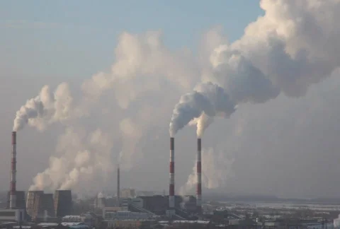 Pipe with smoke in winter sunrise Stock Footage
