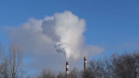 The pipe smokes against the blue sky. Stock Footage 101054011