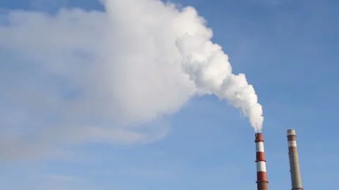 The pipe smokes against the blue sky. Stock Footage 101054044