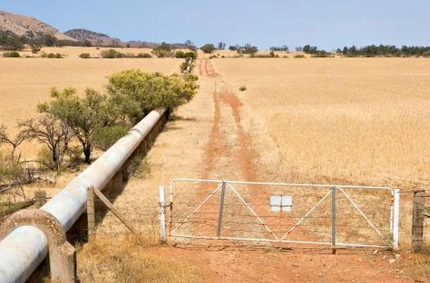 Pipe through farm Stock Photos
