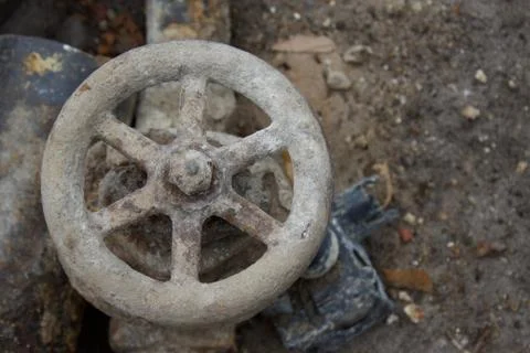 Pipe valve handle from underground pipe Stock Photos