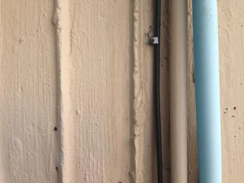 Pipe on the wall textured for background Stock Photos