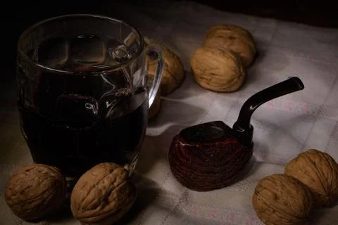 Pipe, wine and walnuts Stock Photos