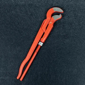 Pipe wrench on black background Stock Photos