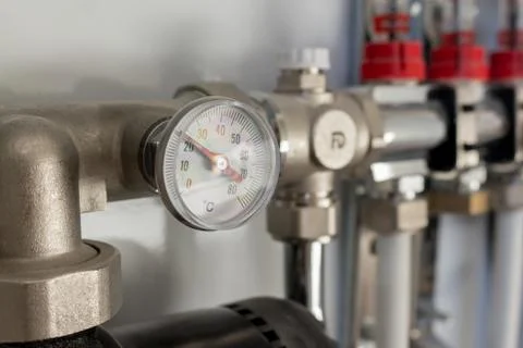 Pipefitter installing system of heating. manometer. warm floor system Stock Photos