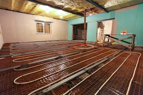 Pipefitter installing system of heating or underfloor heating installation Stock Photos