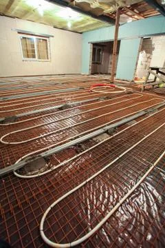 Pipefitter installing system of heating or underfloor heating installation Stock Photos