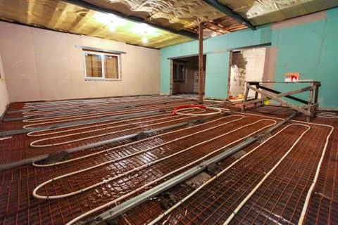 Pipefitter installing system of heating or underfloor heating installation Stock Photos