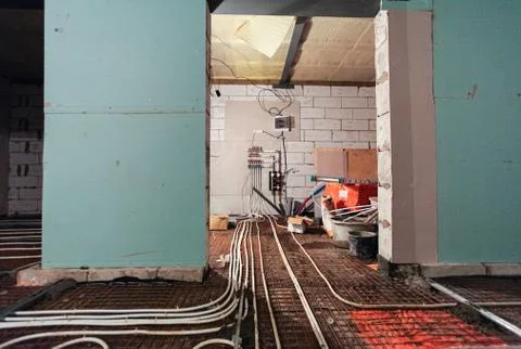 Pipefitter installing system of heating or underfloor heating installation Stock Photos