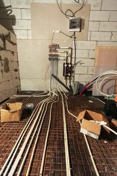 Pipefitter installing system of heating or underfloor heating installation Stock Photos