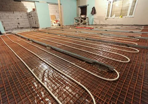 Pipefitter installing system of heating or underfloor heating installation Stock Photos