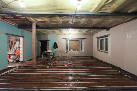 Pipefitter installing system of heating or underfloor heating installation Stock Photos