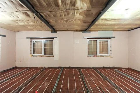 Pipefitter installing system of heating or underfloor heating installation Stock Photos