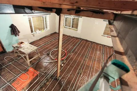 Pipefitter installing system of heating or underfloor heating installation Stock Photos