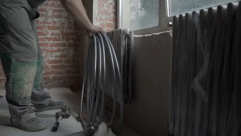 Pipefitter installing system of heating. Repair in the apartment Stock Footage 101551485