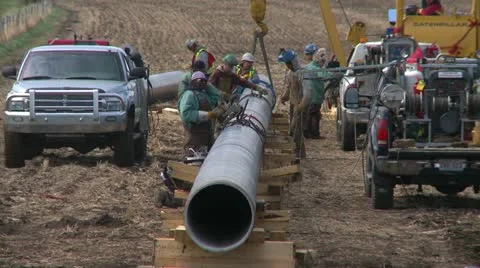 Pipeline construction, welding crew tight shot, #1 Stock Footage
