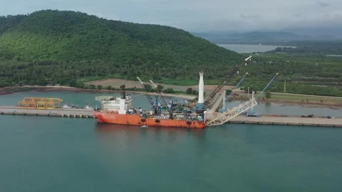 Pipeline installation barge for S Lay method and a jack up rig in a shipyard Stock Footage 316993416