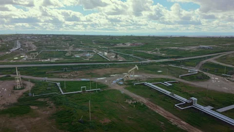Pipeline landscape overview. Views of pipelines amid grassy terrain and Vídeos de archivo 342956990